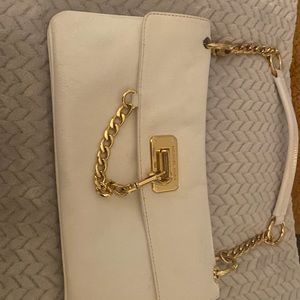 WHITE LEATHER -CLUTCH -HANDLE -GOLD CHAIN -LOCKET TO CLOSE